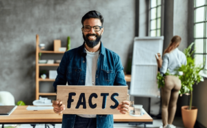 A smiling entrepreneur holding a board with the word "FACTS", poster, photo, cinematic